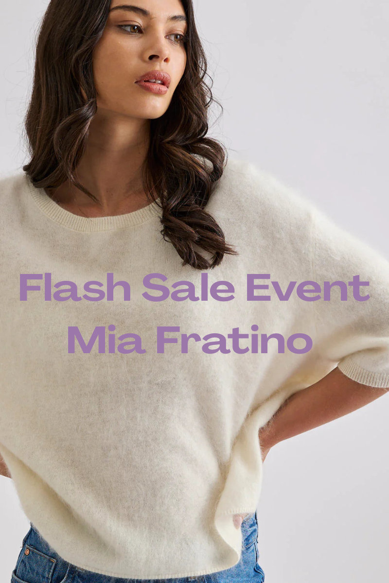 Woman wearing a white fluffy short sleeve oversized sweater with 'Flash Sale Event Mia Fratino' text overlay.
