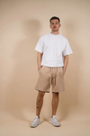 kore studios mens loose fit fleece track shorts with drawcord in tan taupe colour with white tee front