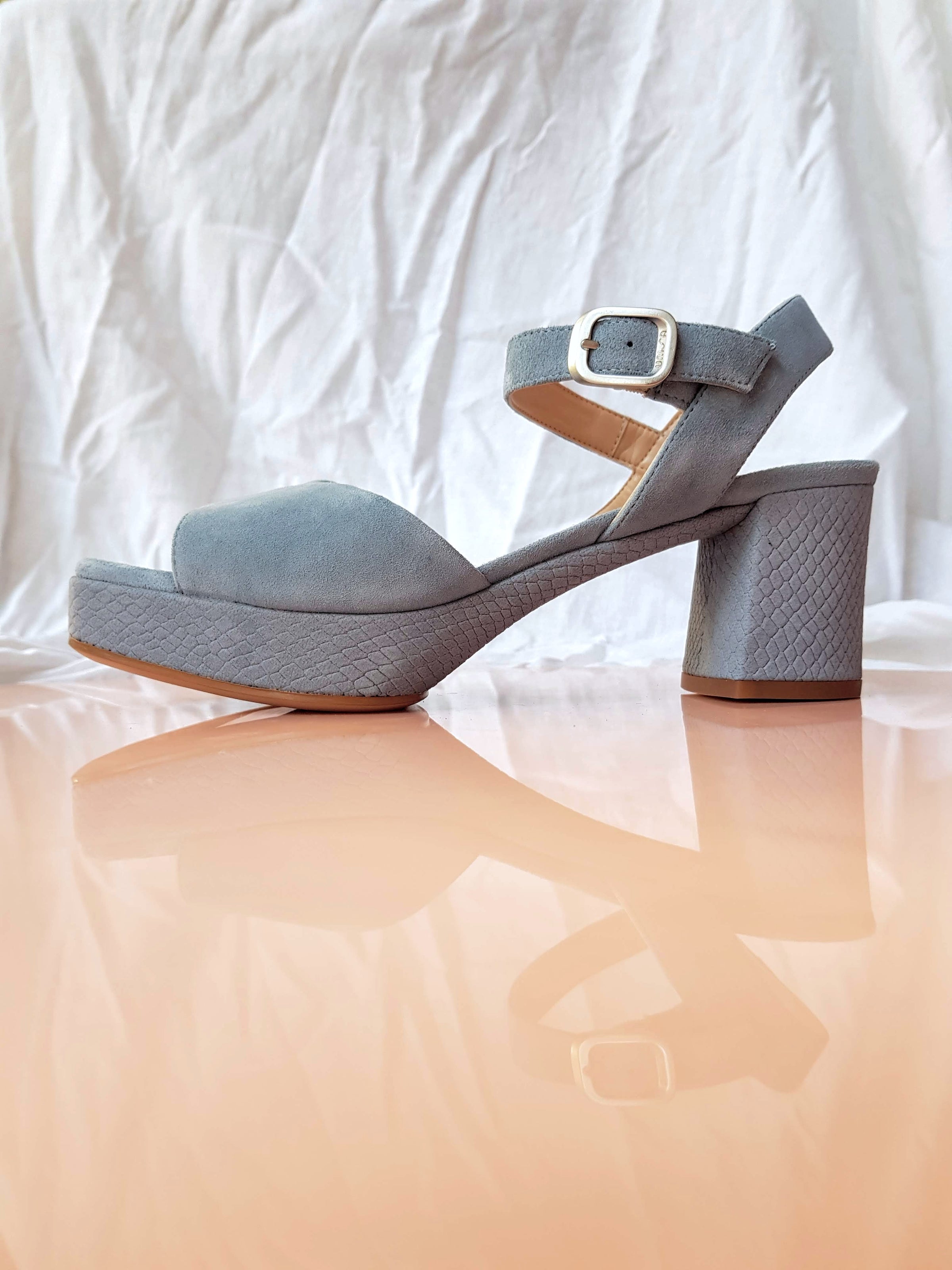 blue suede platform heels with ankle strap and silver buckle python laser cut heel and platform