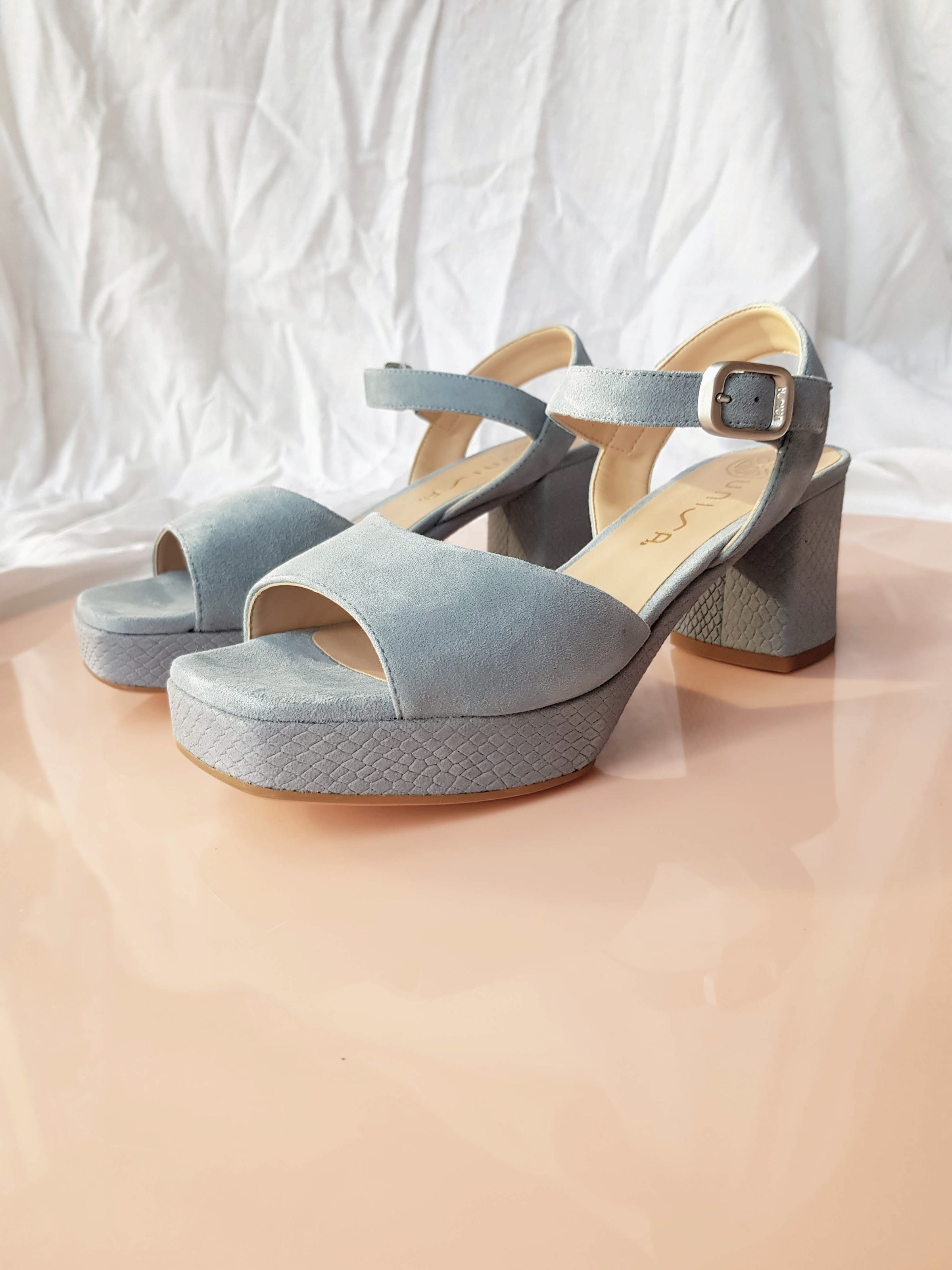 blue suede platform heels with ankle strap and silver buckle square toe