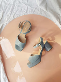 blue suede platform heels with ankle strap and silver buckle