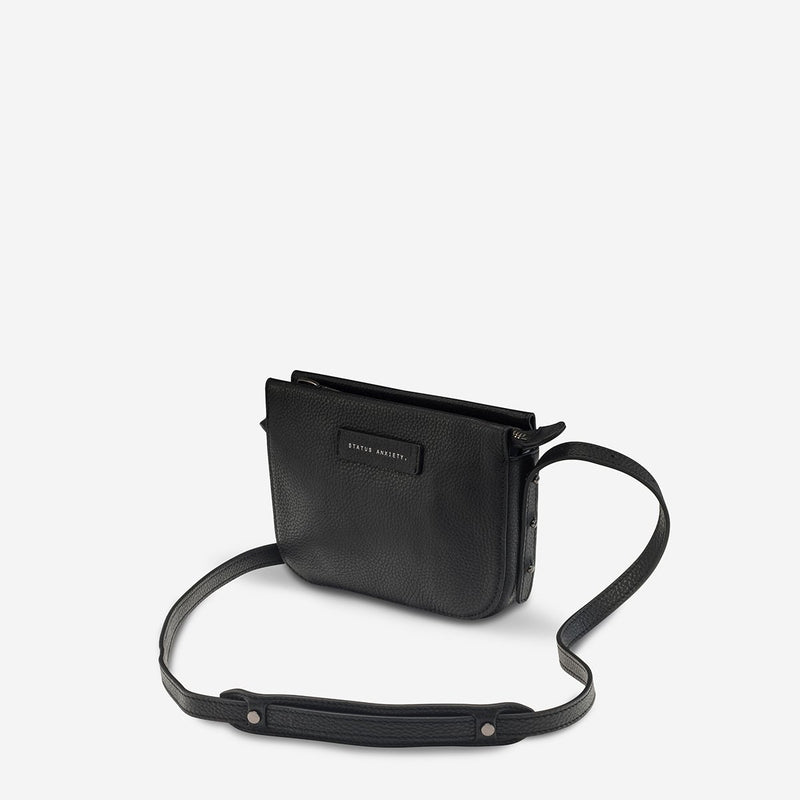 status anxiety black leather crossbody bag in her command front side hunterminx