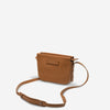 status anxiety tan leather crossbody bag in her command studs side hunterminx