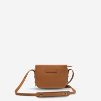 status anxiety tan leather crossbody bag in her command hunterminx