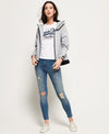 Grey Hooded SD Windtrekker jacket by Superdry worn with jeans